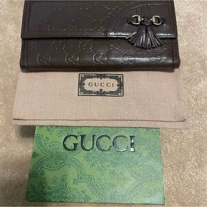 Gucci authentic Dark Brown Embossed Leather Wallet